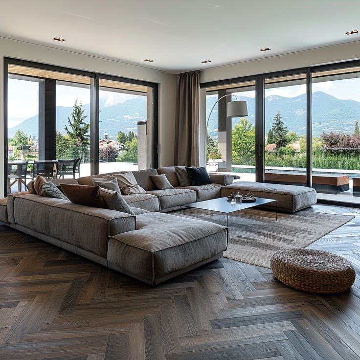 Smoked Oak Herringbone Hardwood — Diagonal Layout in a Glass-Wall Living Room